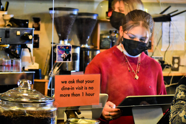 A young worker takes orders at the Blackbird Cafe in Valparaiso. (Justin Hicks/IPB News)
