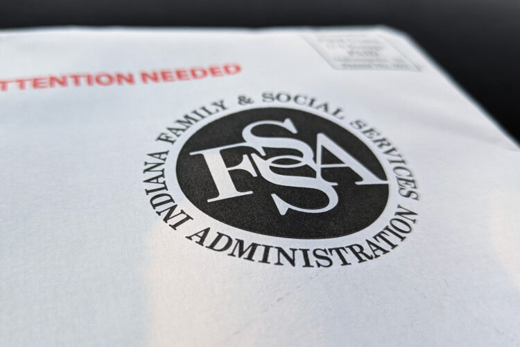 A white envelope with a black Indiana Family and Social Services Administration logo printed on it with the words "Attention needed" printed in bright red.