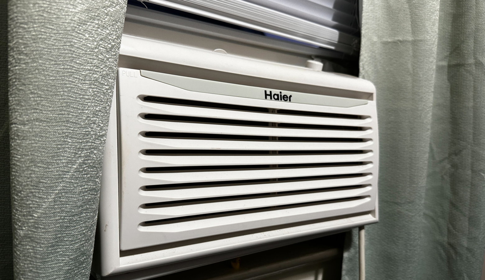 A window A/C unit in an apartment.