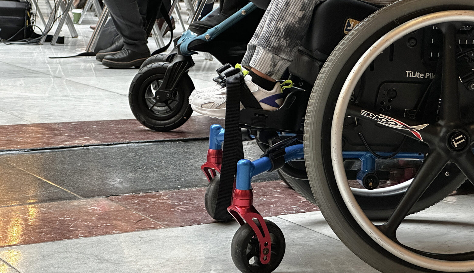 A child sitting in a wheelchair at the Indiana Statehouse.