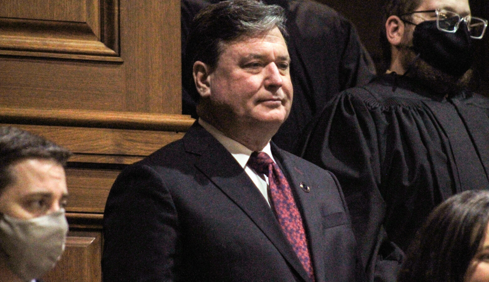 Todd Rokita is a White man with dark, graying hair. He is wearing a black suit, white shirt and red tie.