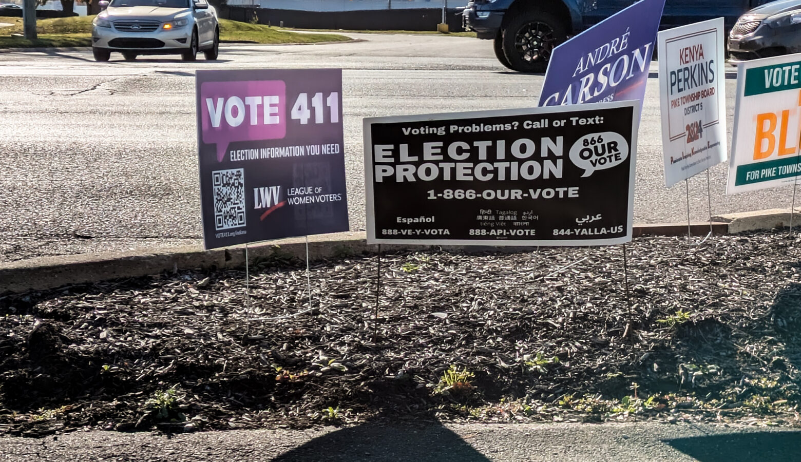 Lawn signs at a polling place.